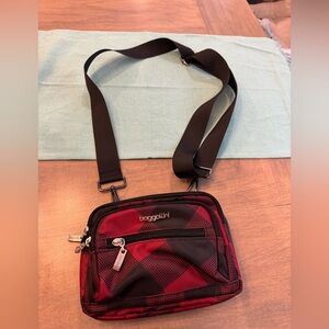 Baggallini Triple Zip Bag. Color: plaid red and black